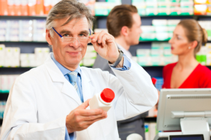 Pharmacist holding a medicine bottle