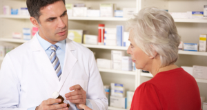 Pharmacist talking to a customer
